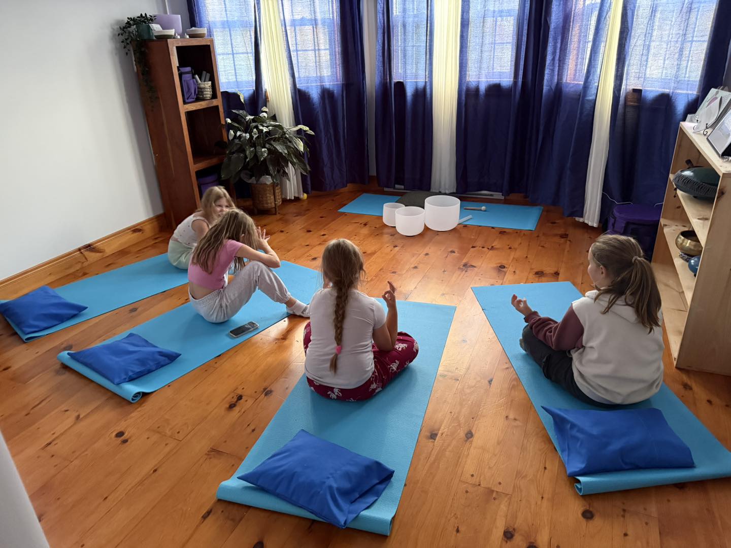 Sound Therapy Session - Children experience calming sound therapy with crystal singing bowls